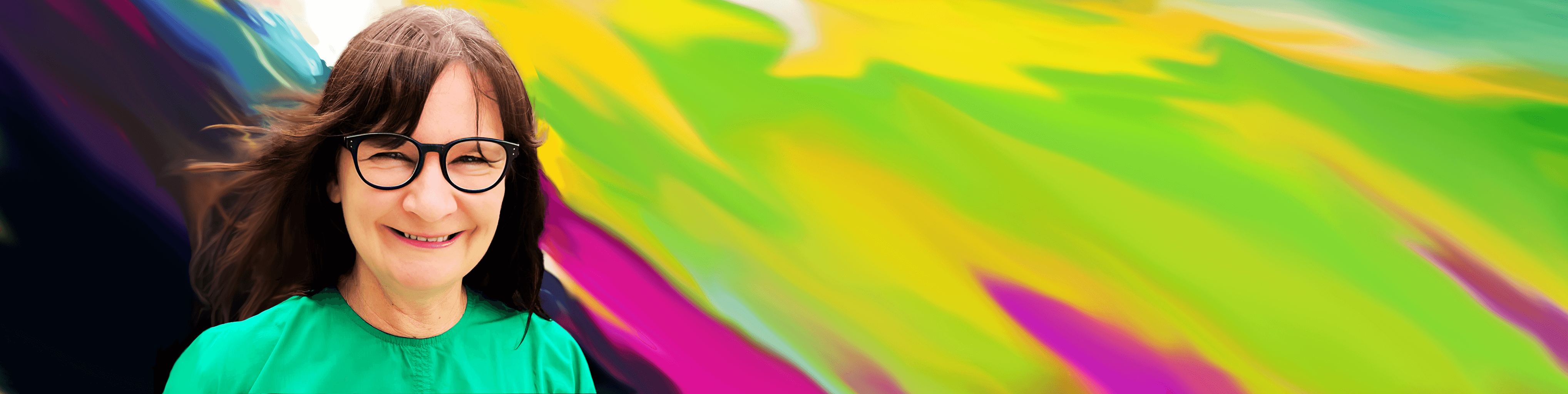 Woman in black glasses on a colourful background